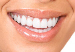 Female smiling with white teeth and pink lipstick 