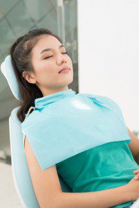 patient sleeping in dentist chair 