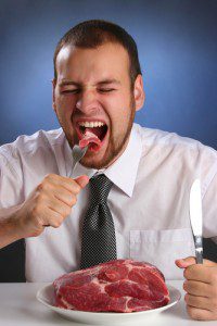 man eating steak