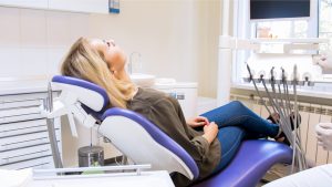 Woman waiting in dentist chair