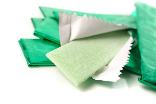 chewing gum and the wrapping foil on white-img-blog