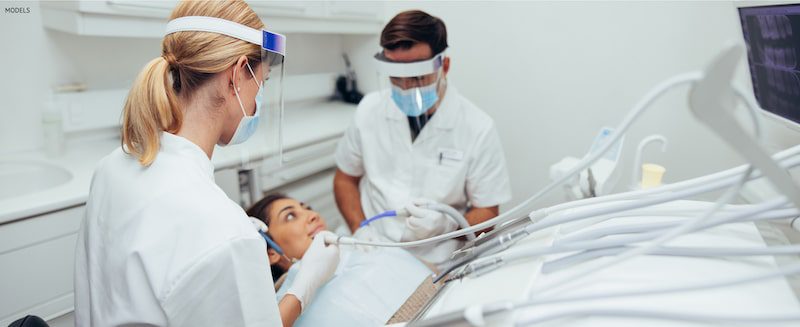 Woman visiting the dental during COVID