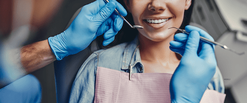 Woman getting her teeth checked at the dentist.