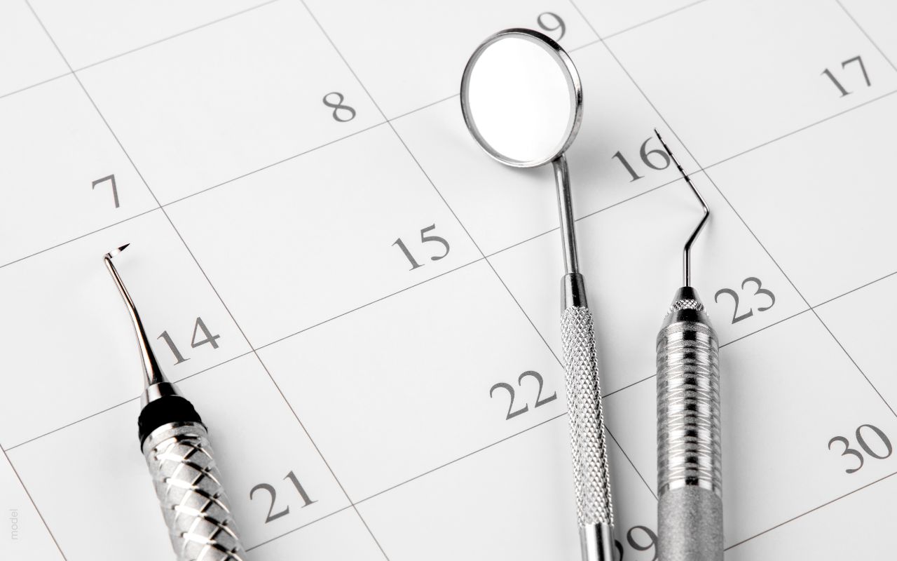 calendar month with dental tools on top