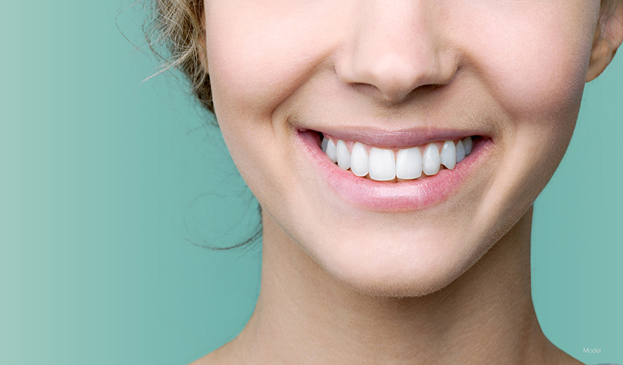 Beautiful smile of young woman with healthy white teeth